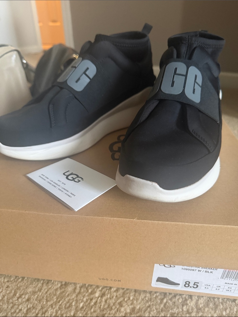 UGG Black Slip-On Sneakers with White Platform Sole